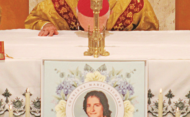 Bishop J. Douglas Deshotel of the Diocese of Lafayette kisses the altar at St. Edwards Church at the start of the annual Charlene Richard Mass. The Mass was celebrated on Aug. 12. Deshotel  led the Cause for Canonization Ceremony for Charlene to officially close the diocesan phase of the process. (Photo by Claudette Oliver/Crowley Post-Signal)