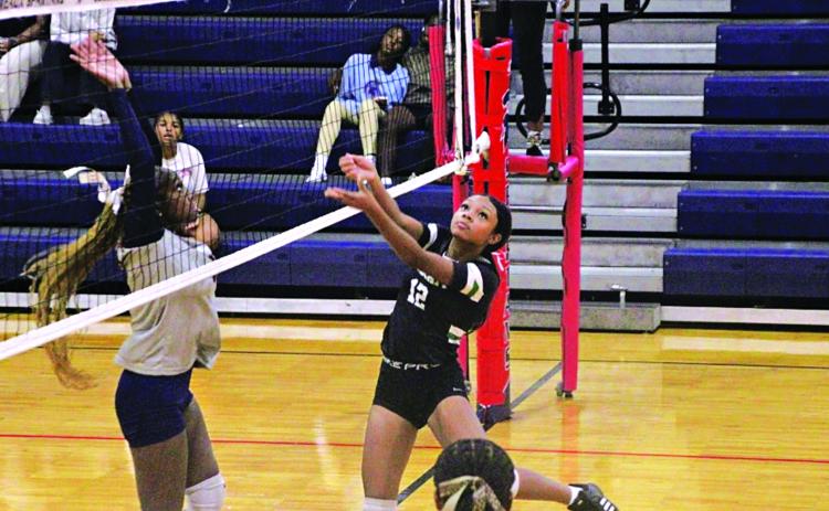 Junior Vivian Fontenot during a scrimmage with Comeaux High of Lafayette. (Photo by Rhett Manuel)