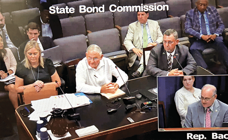 A still image captured from Thursday’s State Bond Commission session in Baton Rouge. Seated, from left, are Lela Folse, commission director; Harold Taylor, Parish Council Administrative-Finance Committee chairman; and Jessie Bellard, St. Landry Parish president. View the State Bond Commission hearing at: https://senate.la.gov/VOD/senate/2025/08/082125sbc.mp4. The portion about St. Landry Parish occurs toward the end of the video.