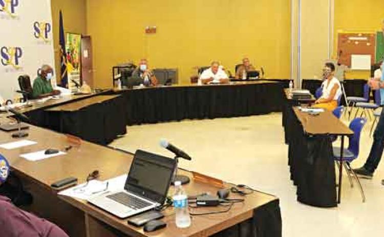 Lyn Henley, standing at right, a representative from Volkert Inc., speaks to St. Landry Parish School Board members on Monday during a meeting to decide on a master plan for a building program. (Photo by Harlan Kirgan)