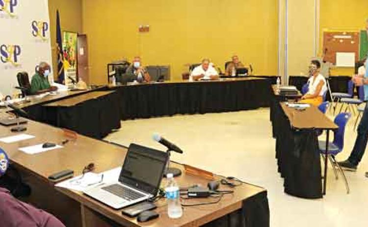 Lyn Henley, standing at right, a representative from Volkert Inc., speaks to St. Landry Parish School Board members on Monday during a meeting to decide on a master plan for a building program. (Photo by Harlan Kirgan)