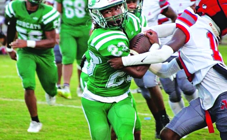 Junior running back Ja’Quan Callaway shakes off a defender and runs for positive yardage in Eunice’s 24-6 win over Abbeville last Thursday in the Acadia-Vermilion Jamboree. (Photos by Rhett Manuel)