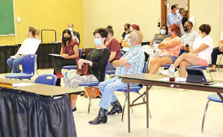 Several people were in the audience at Thursday’s St. Landry Parish School Board meeting and many voiced their approval and disapproval of the School Board’s action on employee vaccination. School employees will be required to be vaccinated or submit to weekly COVID-19 testing. (Photo By Harlan Kirgan)
