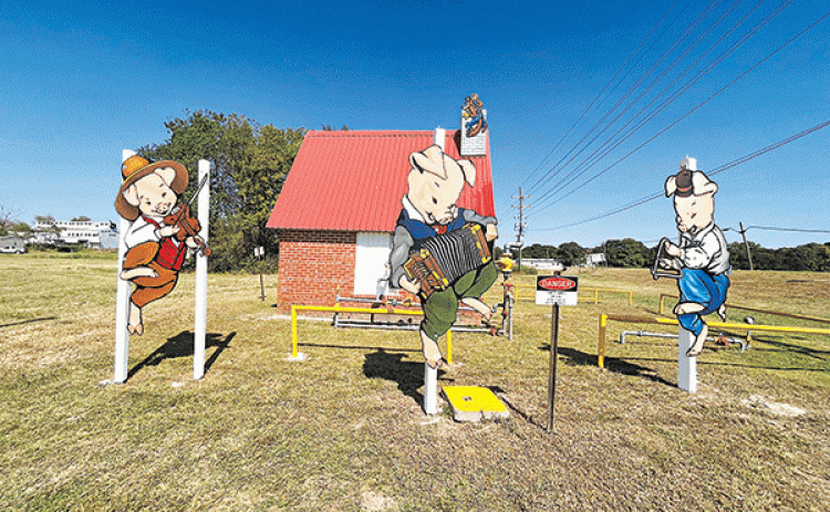 The Three Little Pigs are returned to their home to bring joy to the Town of Mamou just in time to celebrate the Mamou Cajun Music Festival in a couple of weeks. (Ville Platte Gazette photos by Heather Bogard)