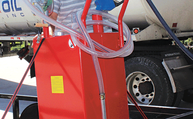 Ricky Melancon of Eunice fills his 35-gallon gasoline container Monday morning for his home generator at Guillory Oil. Melancon has a gasoline generator as well as a propane generator. (Photo by Myra Miller)