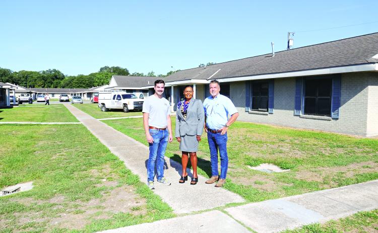 Thirty apartments have been renovated following flooding in 2016 at Acadian Village in Eunice. From left, are Noah Clause, Angelia Guillory and David Clause. Guillory is the Housing Authority director. The Clauses are with Clause and Sons Construction, of Eunice. (Photo by Harlan Kirgan)
