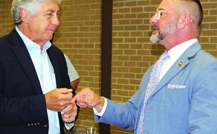 Jonathon “JP” Perry, a Louisiana 3rd Circuit Court of Appeal Judge, speaks with Jacque Pucheu after the meeting. (Photo by Myra Miller)