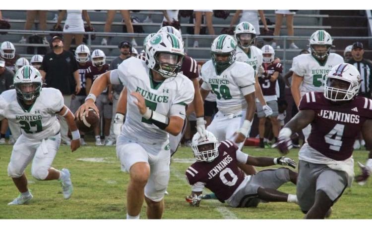Eunice High School Bobcat’s quarterback Montana Brown makes yardage against the Jennings High Bull dogs Friday evening. The Bobcats lost 22-16 against the Bull dogs. (Photo by Rhett Manuel)