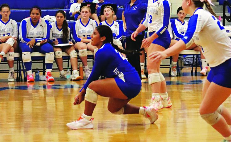 St Edmund’s Seyda Deshotel with a dig  in the match with Opelousas. (Photo by Amy Myers)