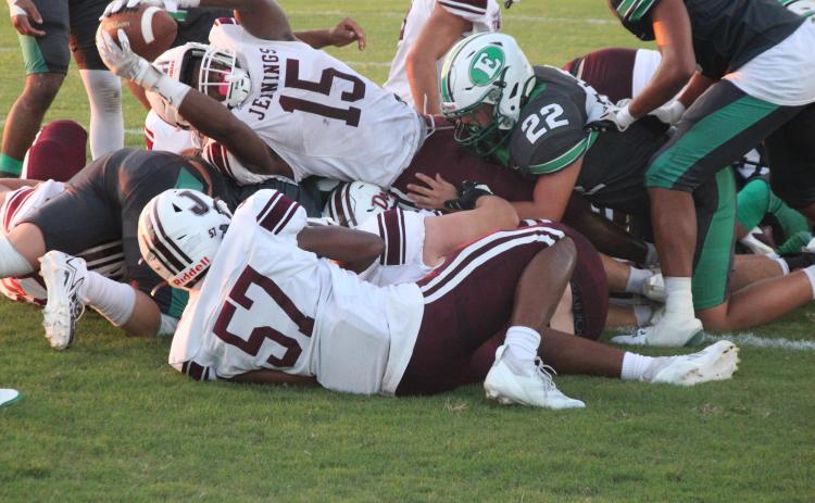 Eunice High’s linebacker Ashton Pedigo makes a tackle during the team’s recent 34-0 loss to Jennings. (Photo by Rhett Manuel)