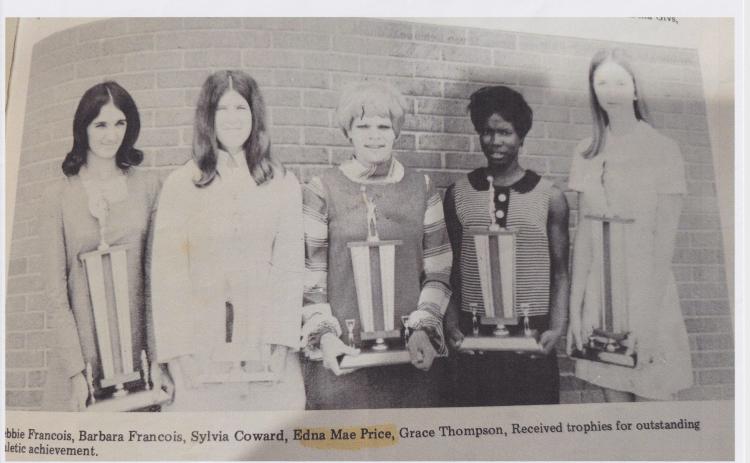 A clipping from The Eunice News. Edna Price is pictured fourth from left. The group of Eunice High students received trophies of outstanding athletic achievements.