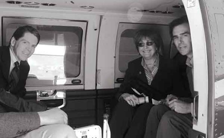 Author Robert Mann, left, on a State Police helicopter with the late Gov. Kathleen Blanco and journalist Tyler Bridges in 2004. (Photo Courtesy of Robert Mann)