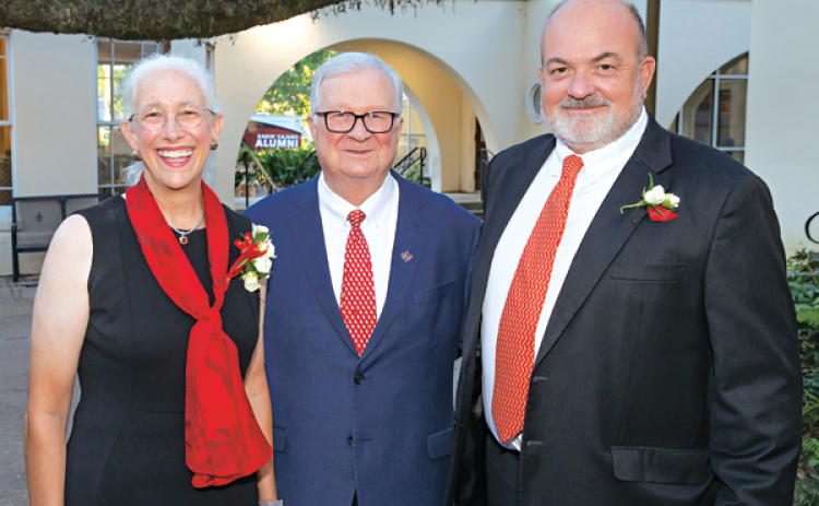 Dr. Amelie A. Hollier, left, and Harold G. Osborn III, right, are the University of Louisiana at Lafayette’s 2022 Outstanding Alumni. The honorees are shown with Dr. Joseph Savoie, UL Lafayette president, during a Sept. 29 reception at the University’s Alumni Center. (Photo by Doug Dugas / University of Louisiana at Lafayette)