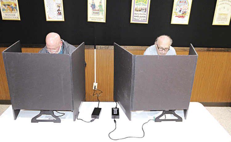 The early voting count for St. Landry Parish as of Thursday was 3,761 with 2,674 votes cast in-person and 1,087 absentee for the Oct. 14 election, according to the Louisiana Secretary of State’s website, geauxvote.com.  Early voting ended on Saturday at the Eunice City Hall and Registrar of Voter’s Office in the courthouse in Opelousas. Marion “Nootsie” Sattler, a Eunice alderman, and Michael Coscino, of Eunice, vote at the Eunice Municipal Complex lobby on Thursday. The election includes candidates for gov