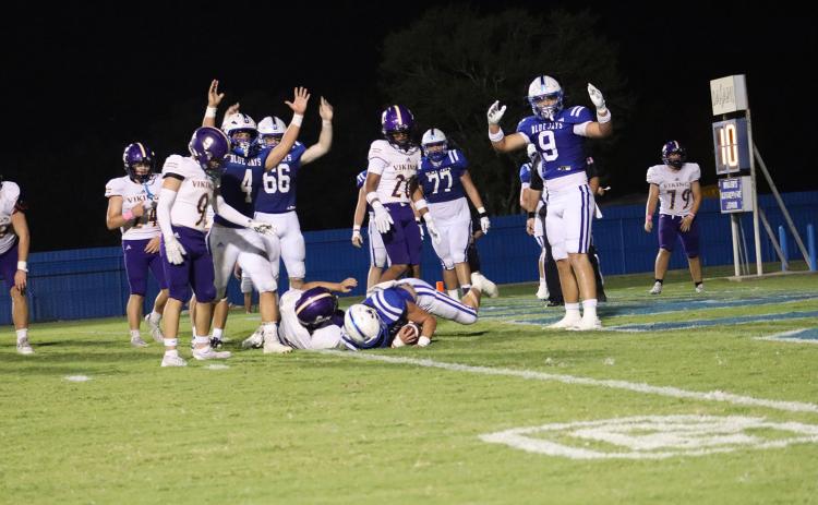 St. Edmund’s Wyatt Dubois, No. 22, wide receiver and safety, scores a touchdown during last Friday’s evening match up against Opelousas Catholic Vikings. (Photo by Amy Myers)