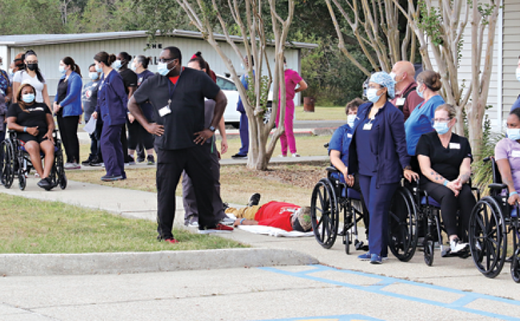 Eunice Manor employees played their part as patients and employees at a drill on  Wednssday. The drill was conducted around a kitchen fire. (Photo by Harlan Kirgan)
