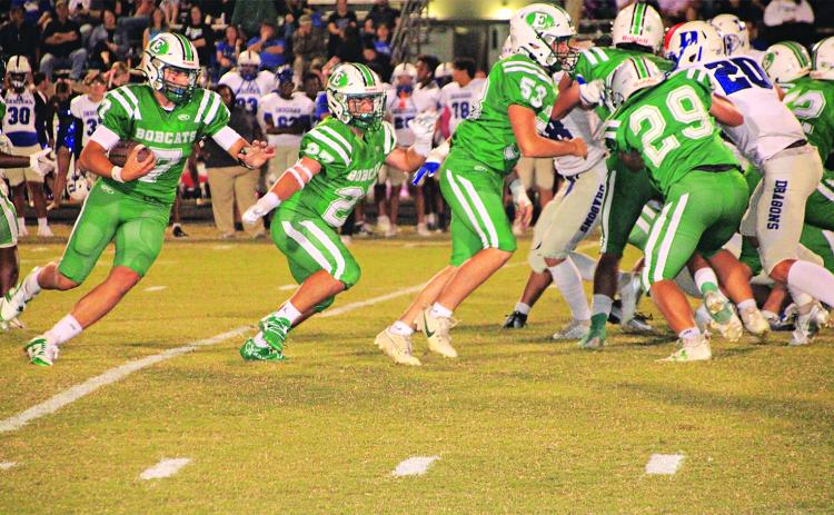 Bobcat running back Montana Brown looks for daylight against DeRidder.