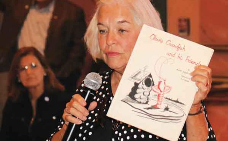 Julie Landry, daugher of Clovis Crawfish founder Mary Alice Fontenot, is shown in October 2018 at a reading she delivered at the Liberty Theatre. Landry will be in Eunice on April 9 to help celebrate Clovis Crawfish’s 61st birthday (Photo by Harlan Kirgan)