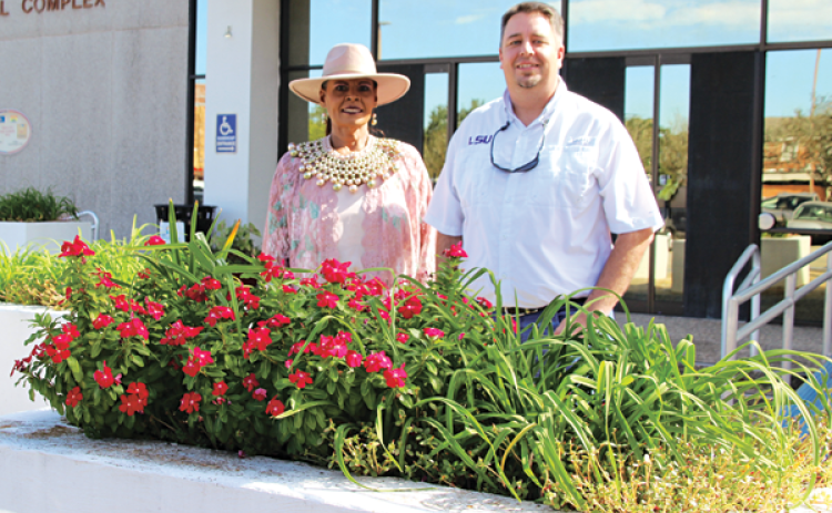Angelia Guillory, community service supervisor, and Mayor Scott Fontenot by a flower box in front of the Eunice Municipal Complex. (Photo by Myra Miller)