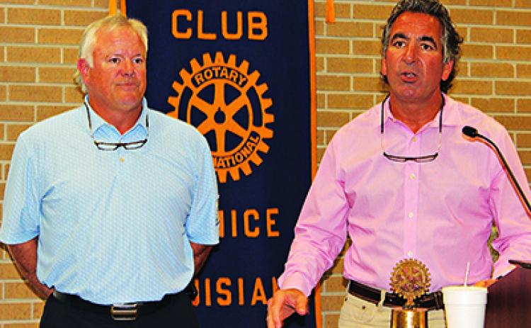 Dwayne Fulton, left, and Clint Bischoff are shown at the Eunice Rotary Club meeting on Wednesday. Fulton spoke about the Falcon Rice Mill in Crowley. Bischoff is a club member. (Photo by Myra Miller)