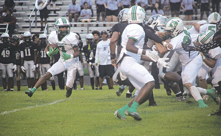 Eunice High’s Malik Thomas hunts for a hole in the Northwest defense. (Photo by Rhett Manuel)