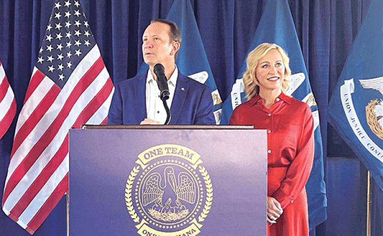 Gov.-elect Jeff Landry and his wife, Sharon, address reporters Oct. 25, 2023, at M.L. “Tigue” Moore Field at the University of Louisiana in Lafayette. (Piper Hutchinson/Louisiana Illuminator)