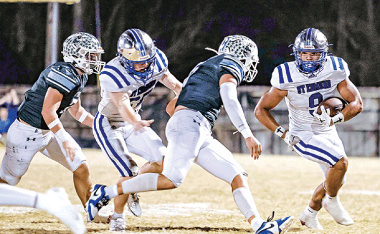 St. Edmund’s Marcus Gradney works to avoid a Catholic-Pointe Coupee pursuit in the 26-22 loss on Oct. 24. (Photo by Dwight Jodon)