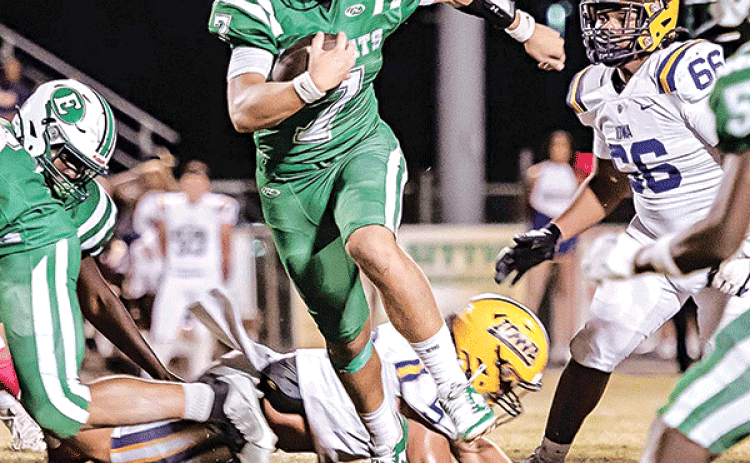 Bobcat quarterback Montana Brown leaps for yards against the Iowa Yellow Jackets in a 48-21 loss on Oct. 25. (Photo by Dwight Jodon)