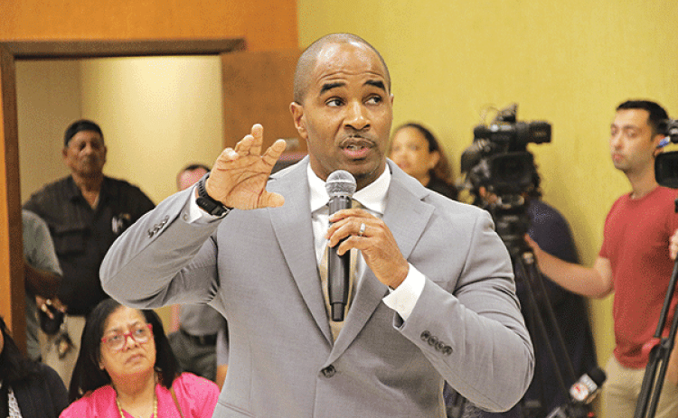 Milton Batiste makes his presentation before being selected as St. Landry Parish superintendent. (Photo by Harlan Kirgan)