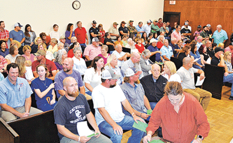 An Acadia Parish courtroom was packed when the Acadia Parish Police Jury held a special meeting to introduce an ordinance to regulate ““sexually oriented businesses” in the unincorporated areas of the parish. The ordinance is in response to a proposed “swingers’ club” between Mowata and Branch. (Photo by Steve Bandy/Crowley Post-Signal)