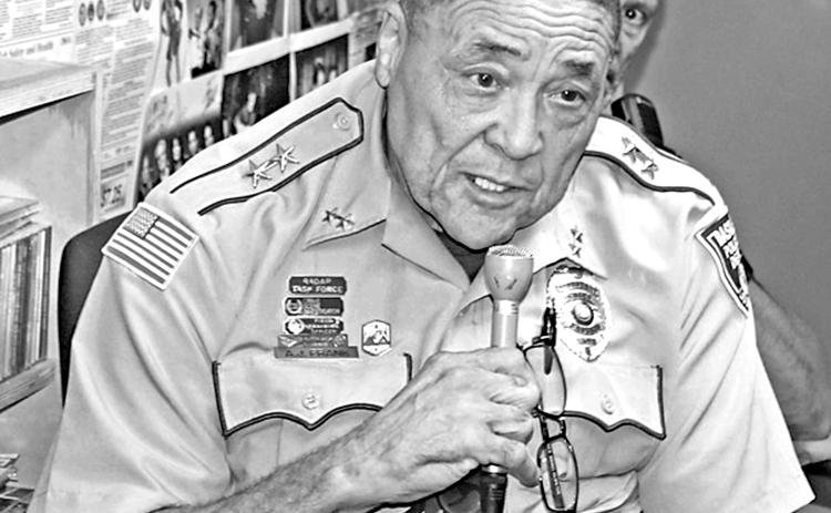 A. J. Frank, assistant police chief for the Town of Basile, speaks during a local law enforcement call-in show program on KVPI radio in Ville Platte. (KVPI Photo)