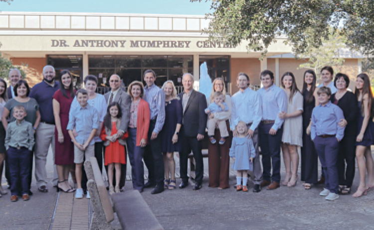 Those attending the ceremony renaming the Acadian Center to the Dr Anthony Mumphry Center at LSUE on Tuesday assembled for a photo. (Photo submitted by LSUE)