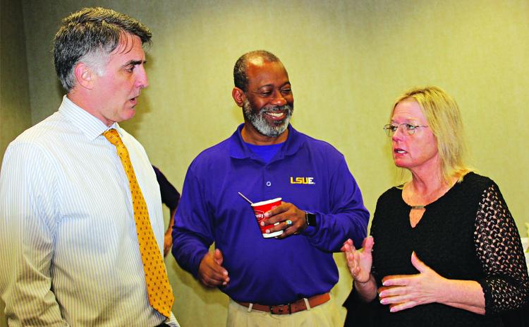 Kelli Bumpus, right, administrative director for graduate medical education with the Edward Via College of Osteopathic Medicine, speaks with LSUE administrators John Hamlin, left, and Chad Jones at Wednesday’s Eunice Rotary Club meeting. Hamlin is vice chancellor for Academic Affairs and Jones is institutional liaison. (Photo by Myra Miller)