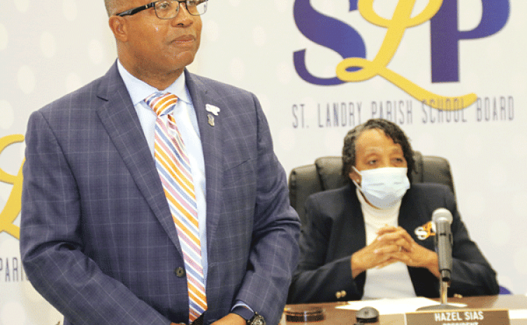 Patrick Jenkins, St. Landry Parish school superintendent, won a 12-month extension of his contract at Thursday’s School Board meeting. Board President Hazel Sias, seated, cast the tie-breaking vote for the contract. (Photos by Harlan Kirgan)