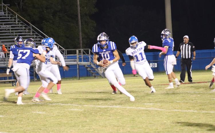 St. Edmund’s quarterback Nathan Zaunbrecher goes for a touchdown during the Blue Jays Homecoming game Friday evening. (Photo by Amy Myers)