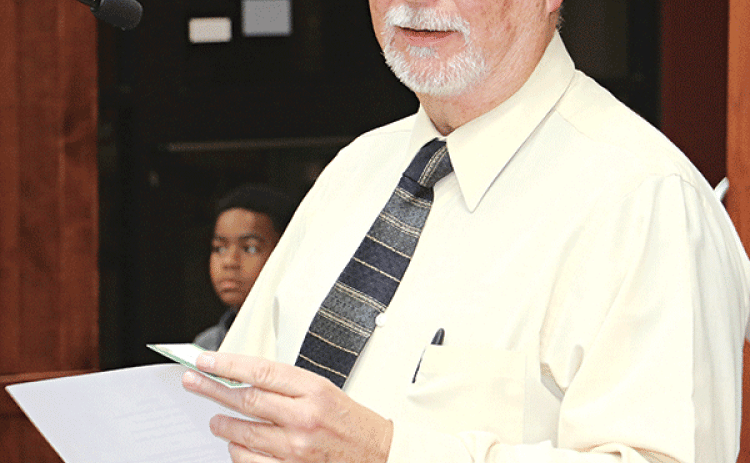 St. Landry Parish Sheriff Maj. Mark LeBlanc, Crime Stoppers coordinator, speaks to the Parish Council on Wednesday about a program to combat littering and dumping. (Photo by Harlan Kirgan)