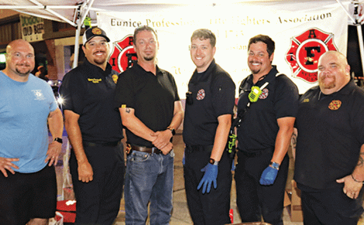 The Eunice firefighters were seen at Eunice’s Fall Back Downtown event Thursday evening. The union held a burgers fund raiser during the event. From left, are Christian Walker, operator; Manny Sandoval, captain; Fire Chief Chaise Brown, Blake Smith, operator; Ben Brown, operator; and Jeremy Faulkner, captain. (Photo by Harlan Kirgan.