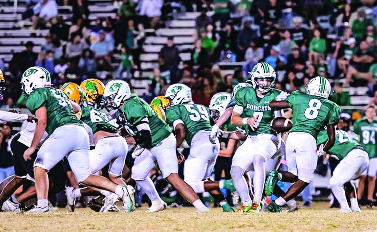 Eunice High’s quarterback Montana Brown goes for the ball to make yardage against Washington-Marion Friday evening. (Photo by Dwight Jodon)