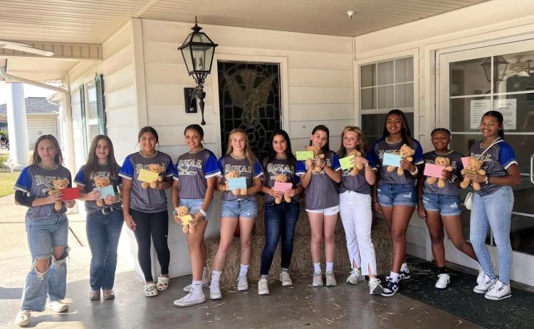 The Royal Select 14u Softball team surprised Oak Lane residents with special gifts and hand written cards.