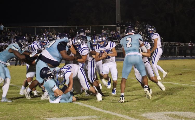 St. Ed’s Blue Jay running back Cooper Berzas carries the ball for yardage against Westminster last Friday evening. (Photo by Amy Myers)