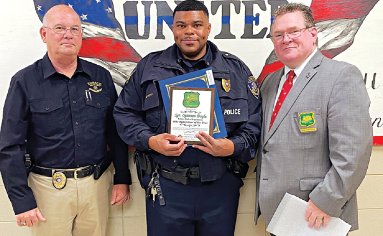 St. Landry Crime Stopper recognized Eunice Police Sgt. Quitin Doyle as the Supervisor of the Year. Doyle, center, is with Eunice Police Chief Randy Fontenot, left, and St. Landry Parish Sheriff’s Deputy Chief Eddie Thibodeaux. (Submitted photo)