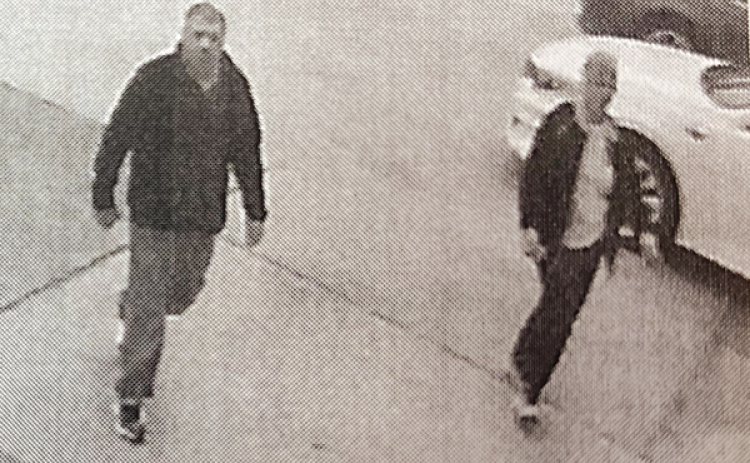 Surveillance image of two people suspected of Cadillace Deville sedan in Crowley. (Photo released by Acadia Crime Stoppers)