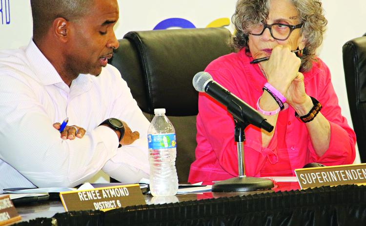 St. Landry Parish School Superintendent Milton Batiste III and School Board President Mary Ellen Donatto confer during Tuesday’s Committee of the Whole meeting. (Photo by Harlan Kirgan)