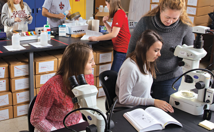 Dr. Kelly L. Robinson, right, is an assistant professor of biology at the University of Louisiana at Lafayette. She led a study that’s offering a broader picture of plankton life in the Gulf of Mexico. (Photo by Doug Dugas / University of Louisiana at Lafayette)