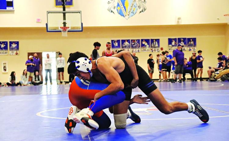 Zander Langlinais of St. Edmund defeating a St. Louis Catholic team member. (Photo by Amy Myers)