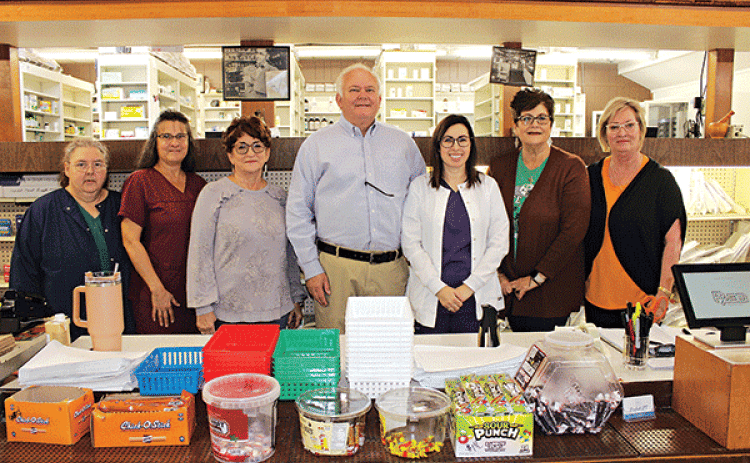 Employees, pharmacist and co-owners at Picou’s Drug Store. From left are Mary Veillon, bookkeeper; Gwen Fontenot, pharmacist technician; Glenda Young, sales clerk; Jed Reviere, co-owner; Christina Brown, pharmacist, co-owner; Pam LaFleur, clerk; and Rowena Thibodeaux, sales clerk. Not pictured are Robby Chachere, pharmacist, Paula Miller, sales clerk; T.C. Chachere, Russell Lejeune, delivery personnel. (Photo by Myra Miller)