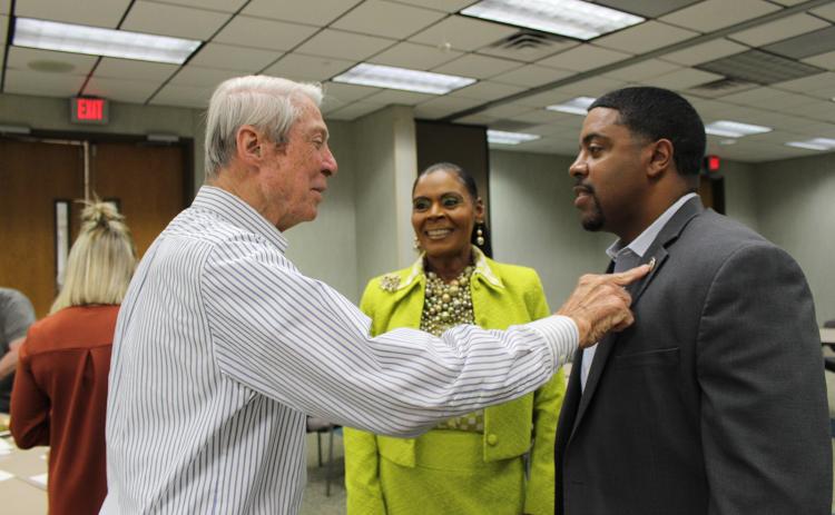 Don Mayeux, left, Angelia Guillory and State Representative Dustin Miller converse before the meeting at the Eunice Rotary Club meeting Wednesday. Mayeux is admiring Miller’s House of Representative pin. Miller was Guillory