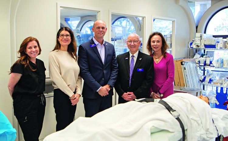 From left at the LSU Alexandria downtown campus on Friday are Heather Perilloux, LSUE surgical technology instructor; Renee Guillory, LSUE surgical technology program director; Jeff Langston, LSUA dean of the College of Health and Human Services; Dr. Paul Coreil, LSUA chancellor; and Dr. Nancee Sorenson, LSUE Chancellor. (Submitted photo)