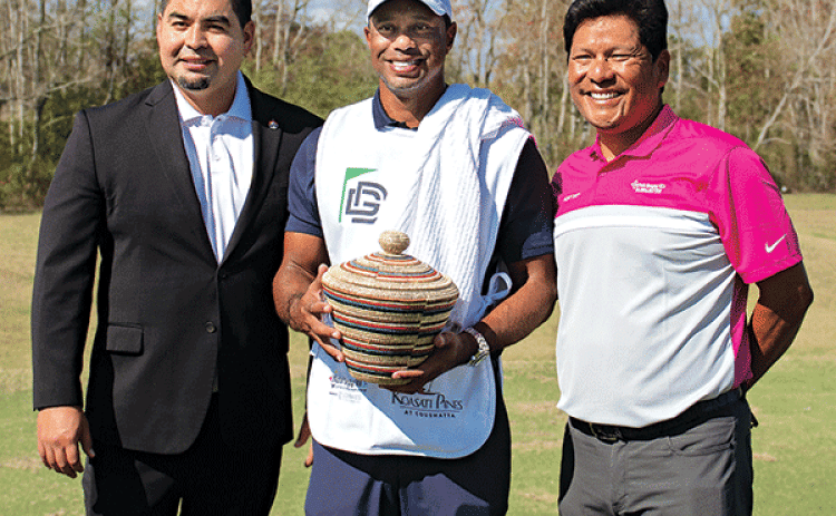 From left, are Coushatta Tribal Chairman Jonathan Cerne, Tiger Woods and Notah Begay III Jr. Cernek presents Tiger Woods with the Coushatta traditional pine needle basket. (Submitted photo)