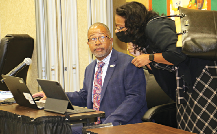 St. Landry Parish School Superintendent Patrick Jenkins and Angela Cassimere, director of  of curriculum, instruction, & assessment, at Thursday's School Board meeting. (Photo by Harlan Kirgan)